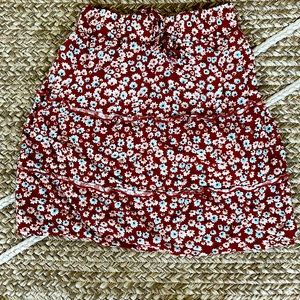 I’m selling and orange skirt with flowers and it’s ruffle like